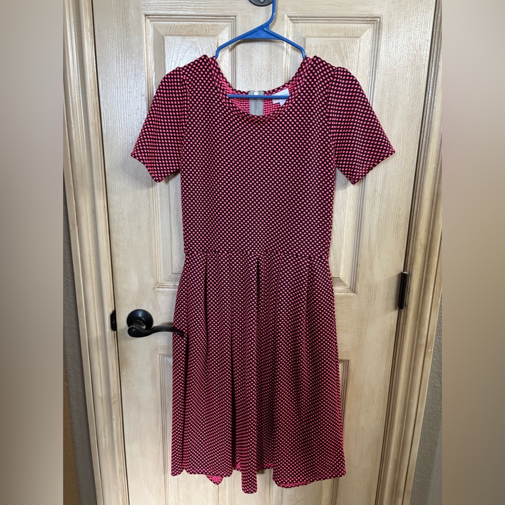 Fun black and pink polka dot Lulalroe Amelia with zipper and pockets.